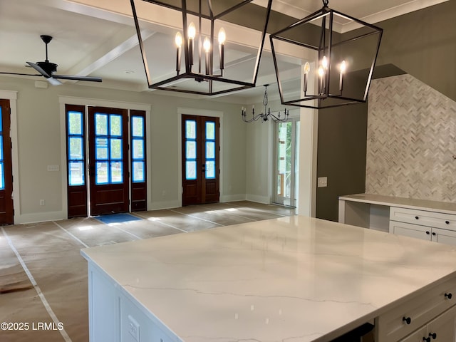 14 Heron Pt, Okatie, SC 29909 - kitchen with a chandelier, white cabinets, open floor plan, light stone counters, and french doors