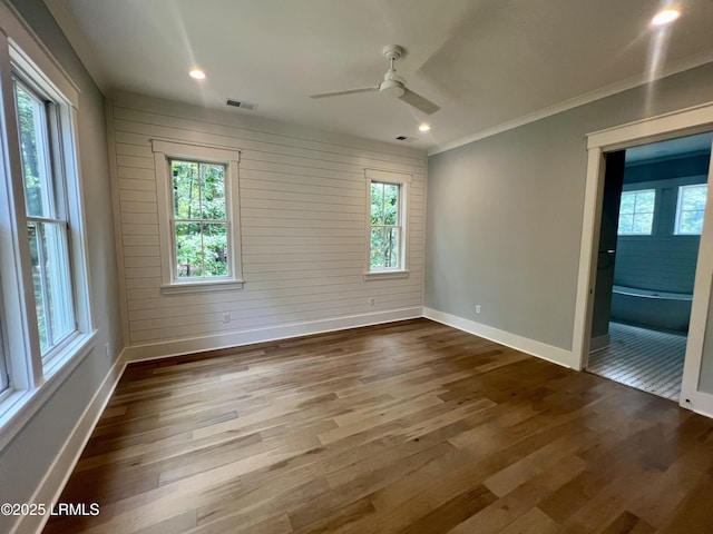 14 Heron Pt, Okatie, SC 29909 - spare room with dark wood-style floors, ceiling fan, ornamental molding, and recessed lighting
