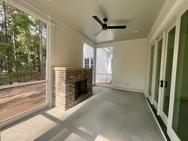 14 Heron Pt, Okatie, SC 29909 - unfurnished sunroom with ceiling fan and a fireplace