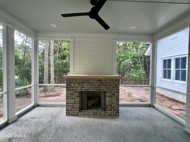 14 Heron Pt, Okatie, SC 29909 - unfurnished sunroom featuring a ceiling fan and an outdoor brick fireplace
