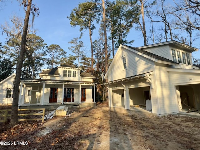 view of front of home with a garage and a porch