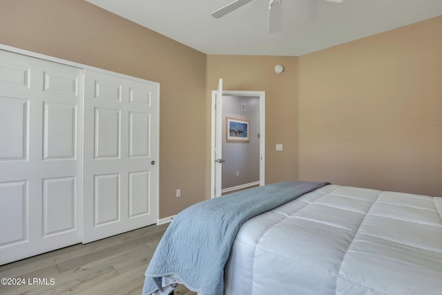 bedroom with a closet, ceiling fan, and light wood-type flooring