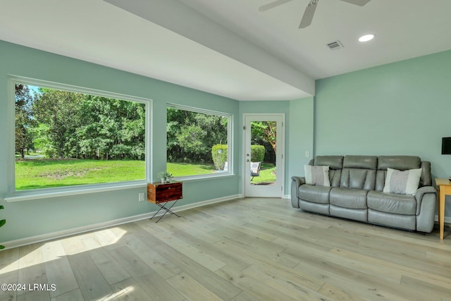 unfurnished sunroom with plenty of natural light and ceiling fan