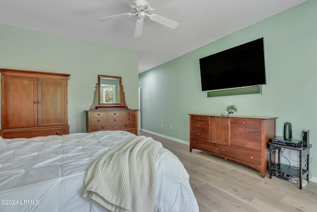 bedroom with ceiling fan and light hardwood / wood-style floors