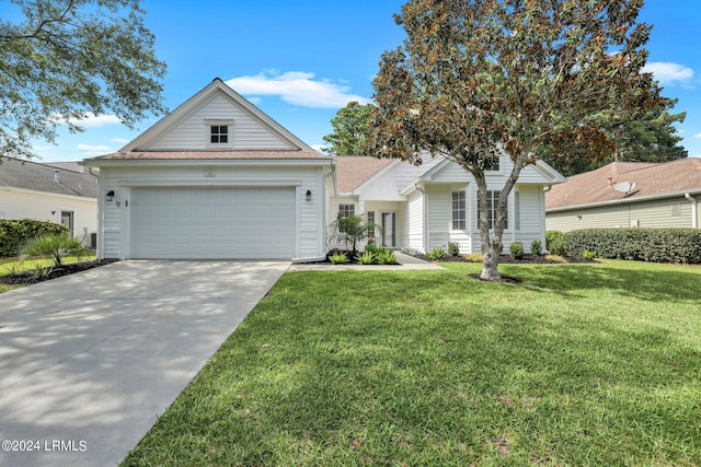 view of front of home featuring a garage and a front yard