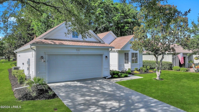 view of front facade featuring a garage and a front lawn