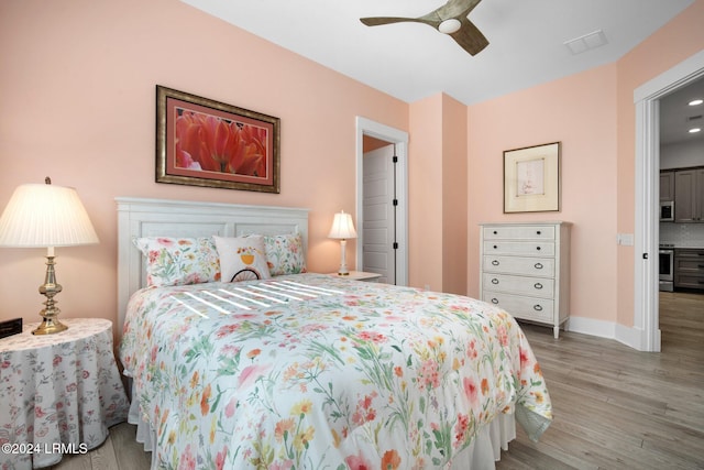 bedroom featuring light wood-type flooring and ceiling fan