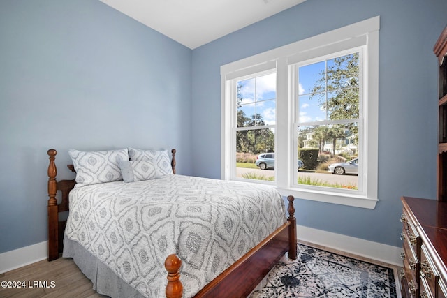 bedroom with wood-type flooring