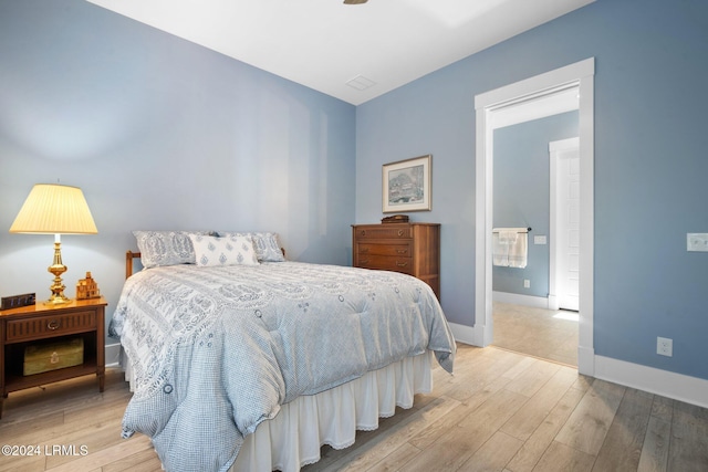 bedroom with light hardwood / wood-style flooring