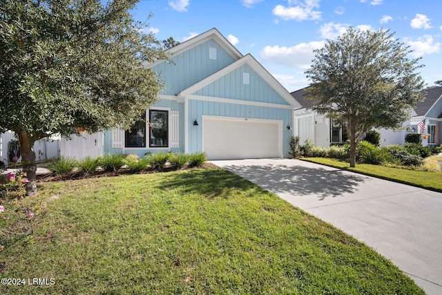 view of front of home featuring a garage and a front lawn