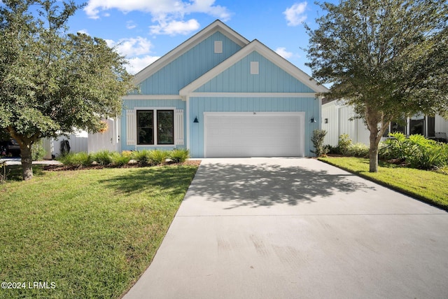 view of front facade with a garage and a front lawn