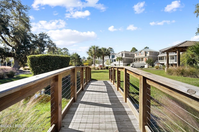 view of property's community featuring a lawn