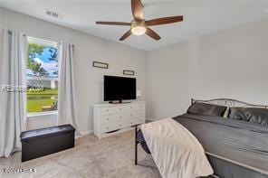 bedroom featuring ceiling fan and light colored carpet