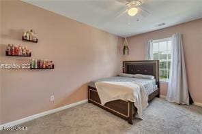 bedroom with ceiling fan and light carpet