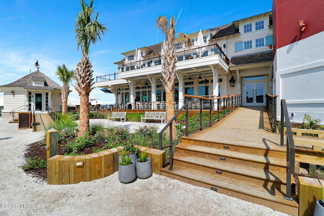 19 Stoney Creek Rd Unit 296, Hilton Head Island, SC 29928 - view of front facade featuring french doors, a ceiling fan, and a balcony