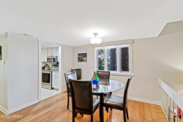19 Stoney Creek Rd Unit 296, Hilton Head Island, SC 29928 - dining room with light wood-style flooring