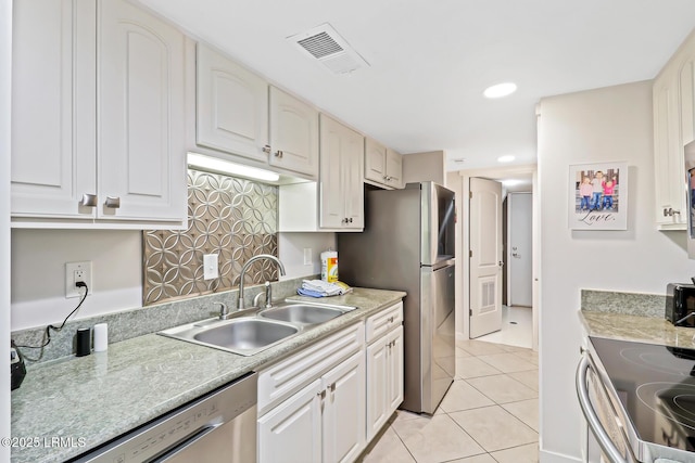 19 Stoney Creek Rd Unit 296, Hilton Head Island, SC 29928 - kitchen featuring light countertops, light tile patterned floors, white cabinetry, appliances with stainless steel finishes, and recessed lighting