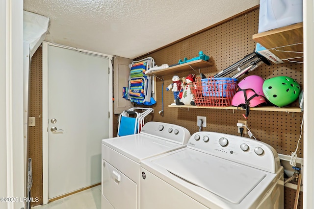 19 Stoney Creek Rd Unit 296, Hilton Head Island, SC 29928 - laundry area with washing machine and clothes dryer and a textured ceiling