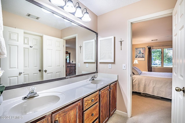 bathroom featuring vanity and a textured ceiling