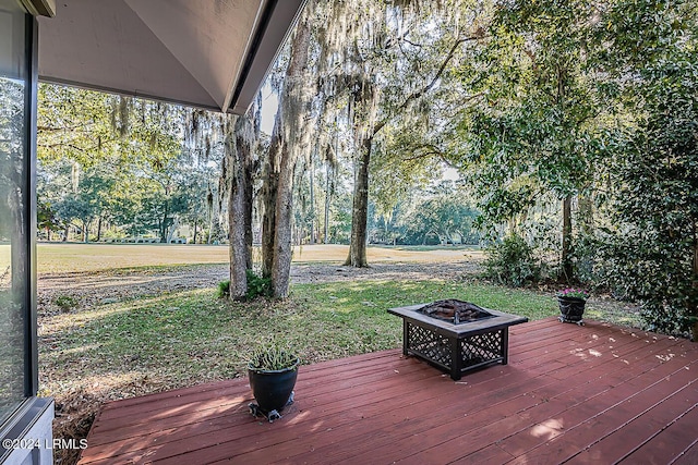 wooden terrace with an outdoor fire pit