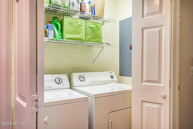 laundry room featuring washing machine and dryer and electric panel