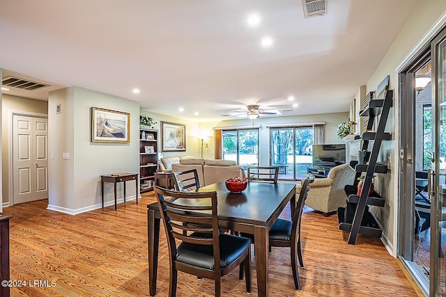 dining space featuring ceiling fan and light hardwood / wood-style flooring