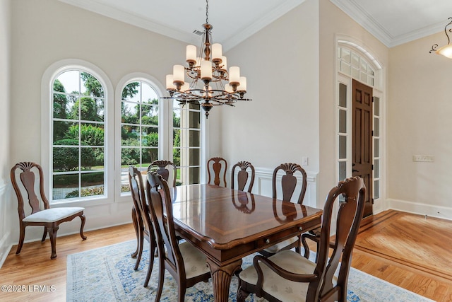 45 Manchester Ct, Bluffton, SC 29910 - dining area with a chandelier, light wood-style floors, ornamental molding, and baseboards