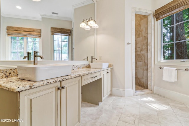 45 Manchester Ct, Bluffton, SC 29910 - bathroom with double vanity, crown molding, marble look tile flooring, baseboards, and a tile shower