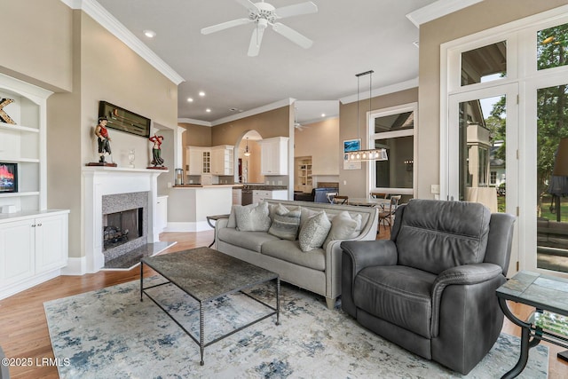 45 Manchester Ct, Bluffton, SC 29910 - living room with crown molding, ceiling fan, recessed lighting, light wood finished floors, and a premium fireplace