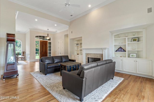 45 Manchester Ct, Bluffton, SC 29910 - living room with built in shelves, light wood finished floors, baseboards, ornamental molding, and recessed lighting