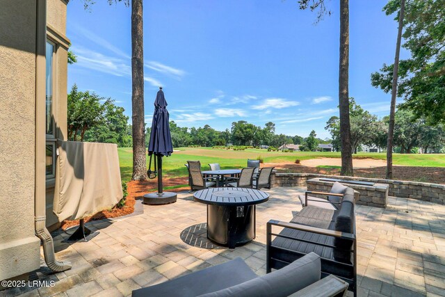 45 Manchester Ct, Bluffton, SC 29910 - view of patio with a fire pit, view of golf course, and outdoor dining area