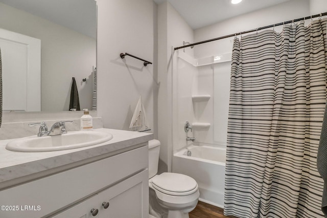 580 Rudy Dr, Hardeeville, SC 29927 - full bathroom with wood finished floors, toilet, vanity, and shower / bathtub combination with curtain