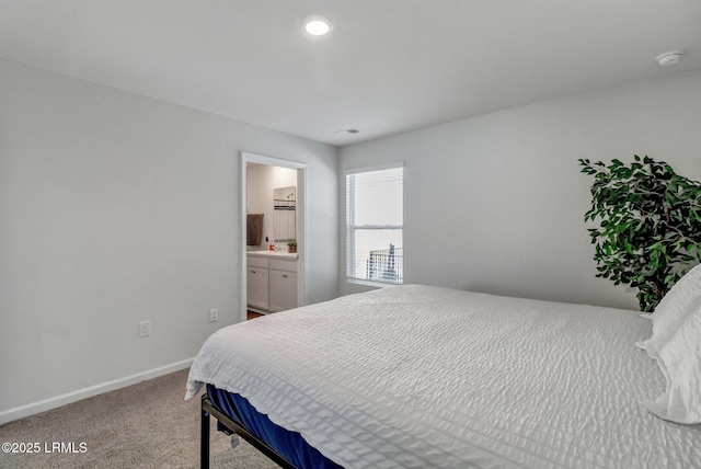 580 Rudy Dr, Hardeeville, SC 29927 - bedroom featuring baseboards, ensuite bath, and light carpet