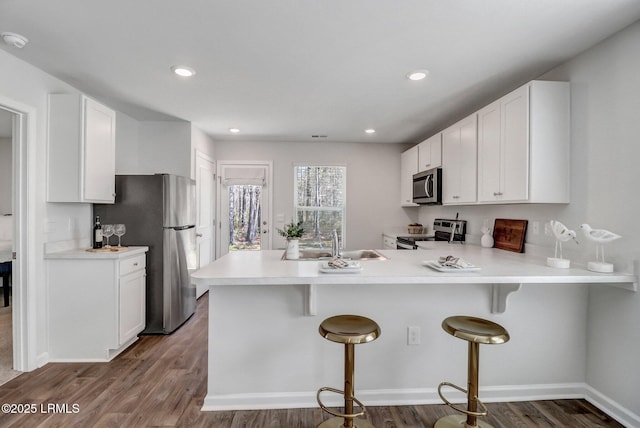 580 Rudy Dr, Hardeeville, SC 29927 - kitchen featuring white cabinets, light countertops, and appliances with stainless steel finishes