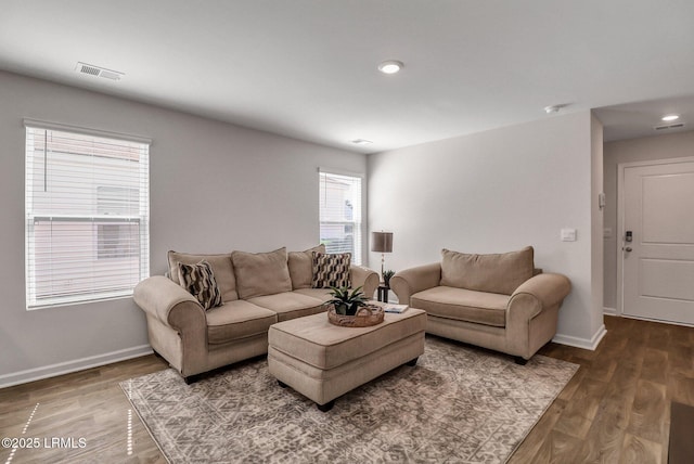 580 Rudy Dr, Hardeeville, SC 29927 - living room with wood finished floors, baseboards, and visible vents