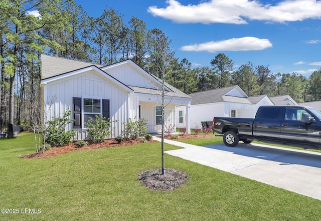 580 Rudy Dr, Hardeeville, SC 29927 - modern inspired farmhouse featuring board and batten siding and a front lawn