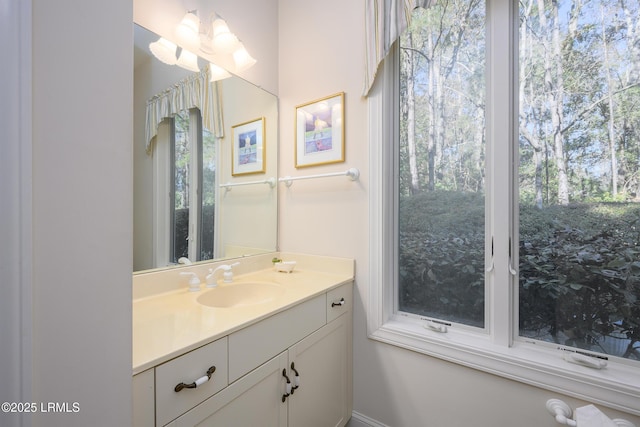 bathroom with plenty of natural light and vanity