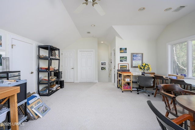 carpeted office with vaulted ceiling and ceiling fan