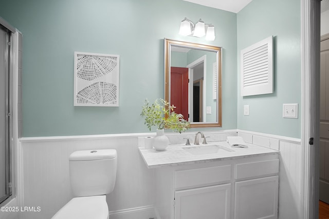 bathroom with vanity and toilet