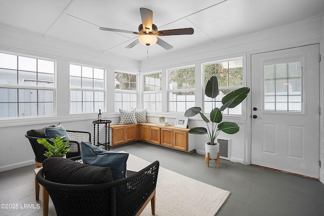 sunroom / solarium with a wealth of natural light and ceiling fan