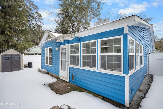 view of front facade featuring a storage unit