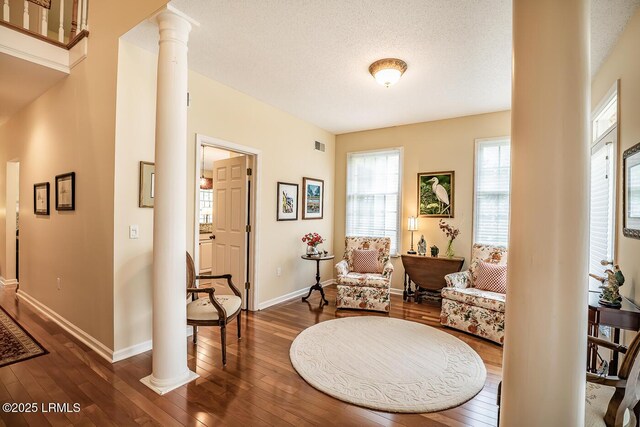 459 Bb Sams Dr, Saint Helena Island, SC 29920 - living area featuring dark wood finished floors, decorative columns, and baseboards