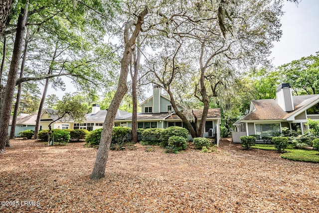 459 Bb Sams Dr, Saint Helena Island, SC 29920 - rear view of property featuring a chimney