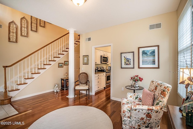 459 Bb Sams Dr, Saint Helena Island, SC 29920 - interior space with stairway, visible vents, dark wood finished floors, and decorative columns