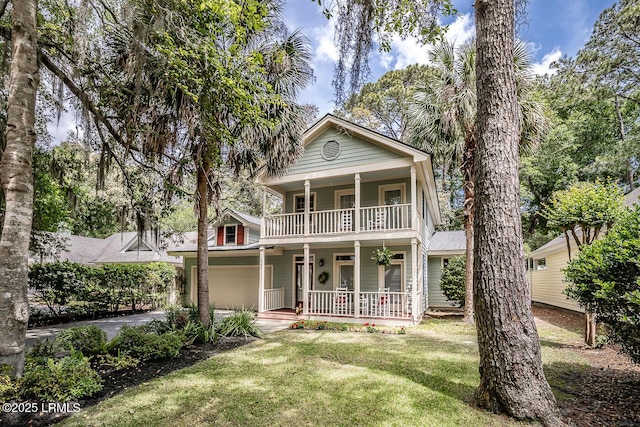 459 Bb Sams Dr, Saint Helena Island, SC 29920 - greek revival inspired property featuring a front lawn, a garage, a balcony, covered porch, and driveway