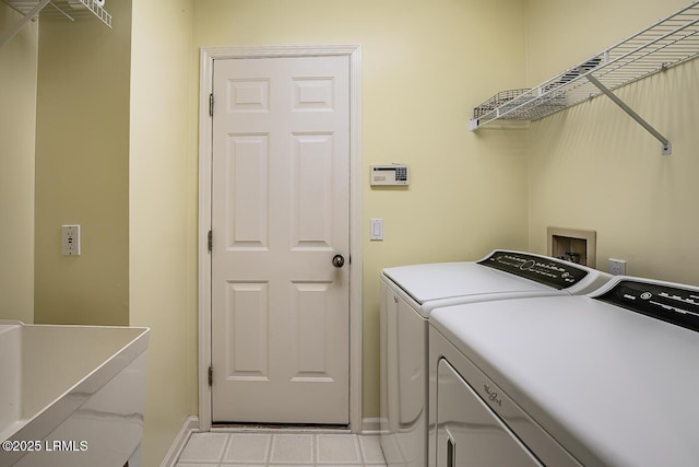 459 Bb Sams Dr, Saint Helena Island, SC 29920 - laundry room featuring tile patterned floors, washing machine and clothes dryer, laundry area, and baseboards