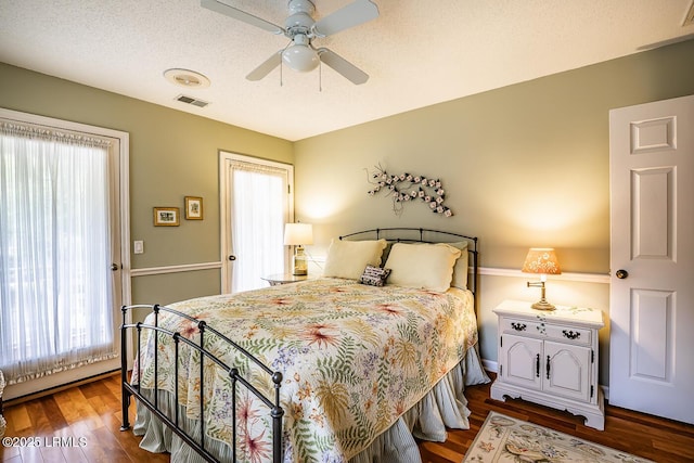 459 Bb Sams Dr, Saint Helena Island, SC 29920 - bedroom with visible vents, dark wood finished floors, and multiple windows