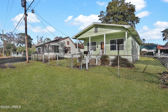 bungalow-style home featuring a front yard and covered porch