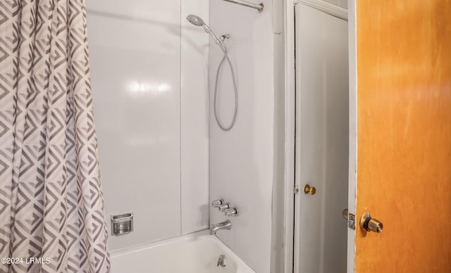 bathroom with shower / bath combination with curtain