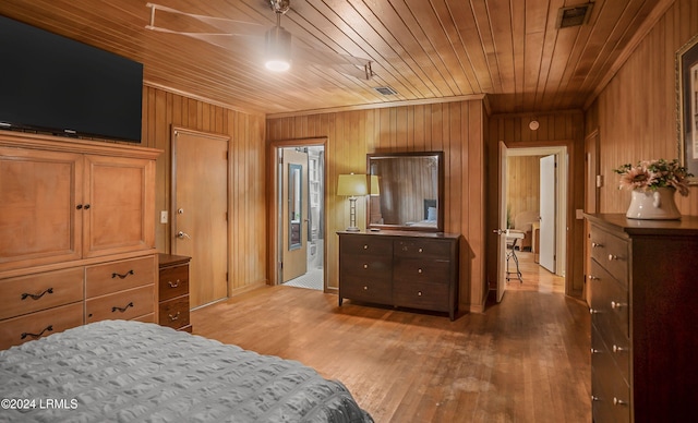 bedroom with hardwood / wood-style flooring, wooden ceiling, and wood walls